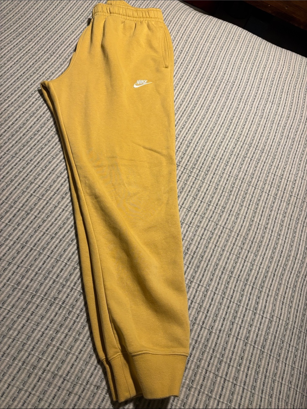 Nike men’s Yellow or gold Club Fleece Joggers with White Swoosh